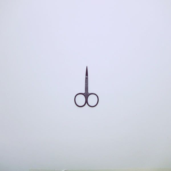 Small matt black embroidery makers scissors.