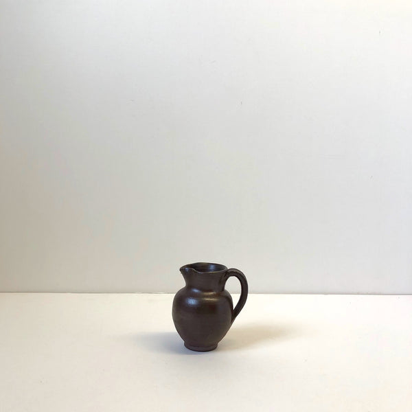 Tiny earthenware jug