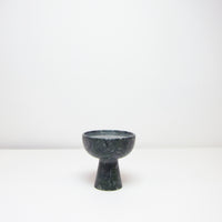 Small green marble plinth