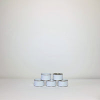 Plain white paint tins