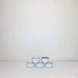 Plain white paint tins