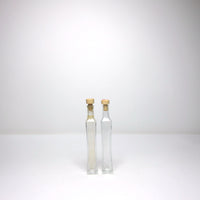Tall thin bottle with cork stopper