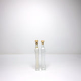 Tall thin bottle with cork stopper