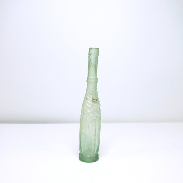 Vintage tall thin green glass bottle