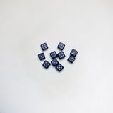 Ten black bakelite dice