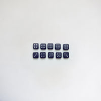 Ten black bakelite dice