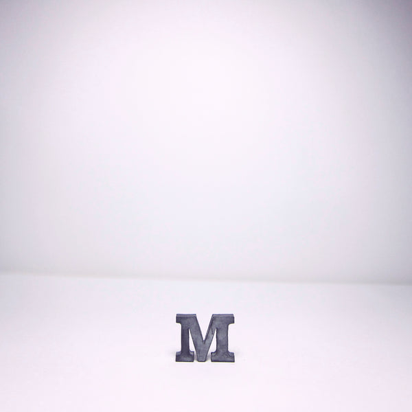 Small metal M
