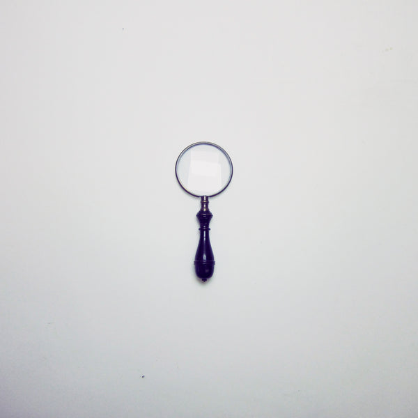 Vintage black magnifying glass