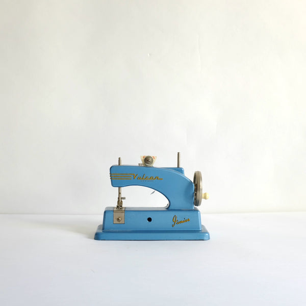 Toy blue vulcan sewing machine