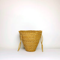 Weaved wicker basket with rope straps