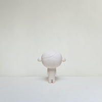 White ceramic doll