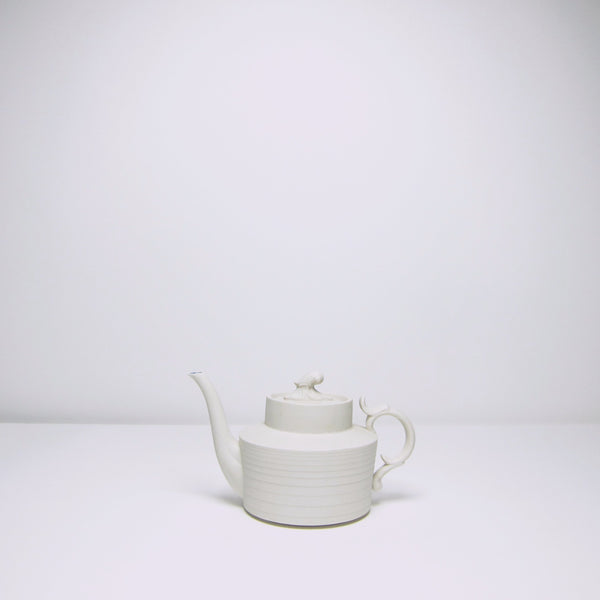 Ornate ceramic teapot.