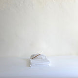 White double sheet with taupe trim