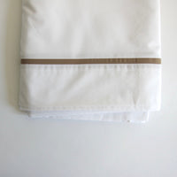 White double sheet with taupe trim