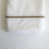 White double sheet with taupe trim