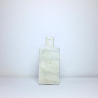 White marble board with handle