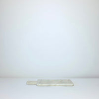 White marble board with handle