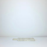 White marble board with handle
