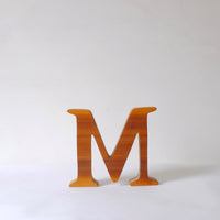 Hand carved wood M
