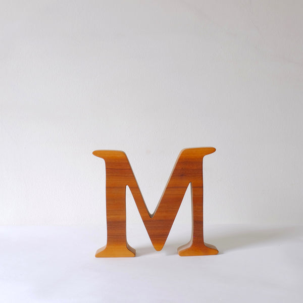 Hand carved wood M