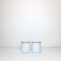 Plain white paint tins