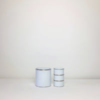 Plain white paint tins