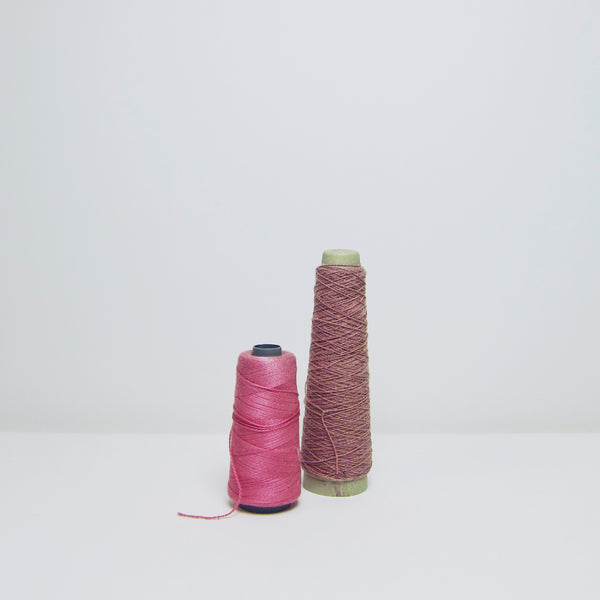Pair of pink thread reels