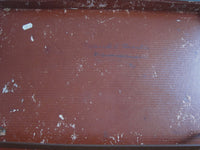 Thin brown leather suitcase