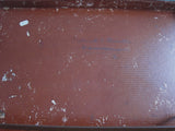 Thin brown leather suitcase
