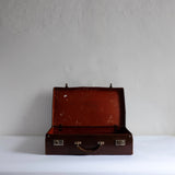 Thin brown leather suitcase