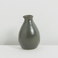 Tiny charcoal clay jug