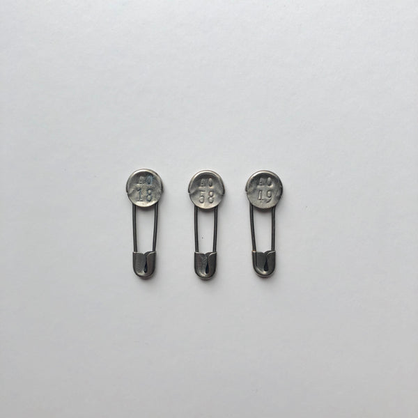 Vintage prison metal laundry pins